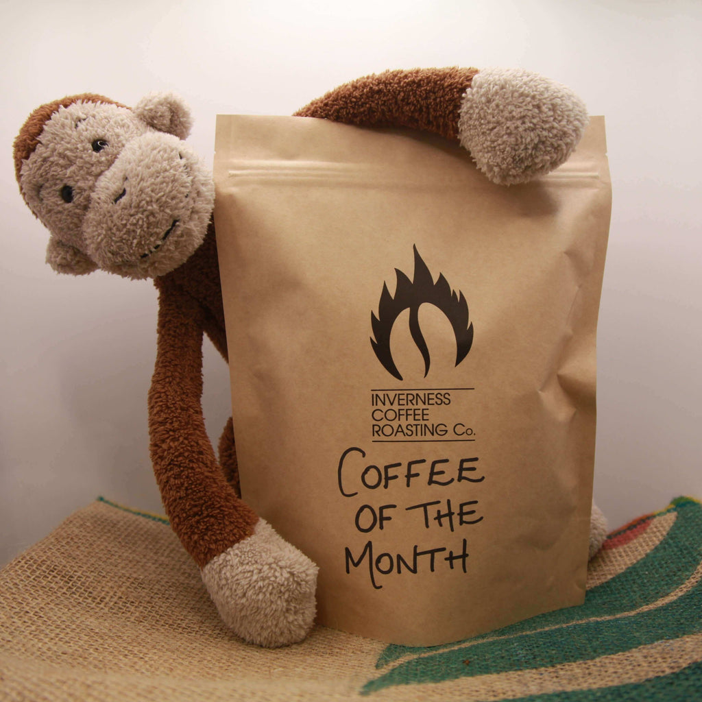 Packet of "Coffe of the Month" coffee made by Inverness Coffee Roasting Co. roaster